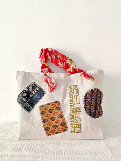 Eco-friendly large capacity tote with minimalist design and artisanal patchwork details for versatile fashion