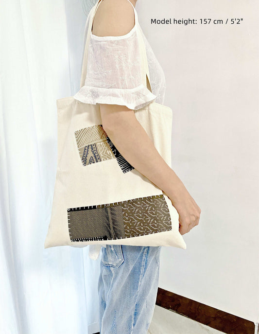 large capacity tote with unique hand-stitched patchwork details