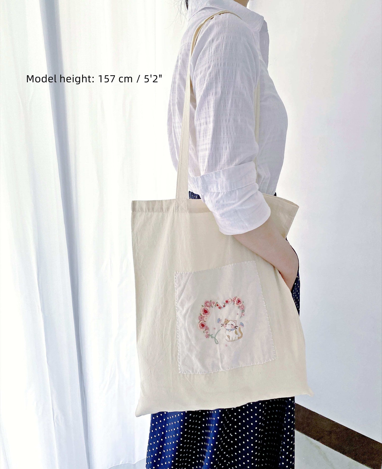 eco-conscious tote with hand embroidered whimsical designs