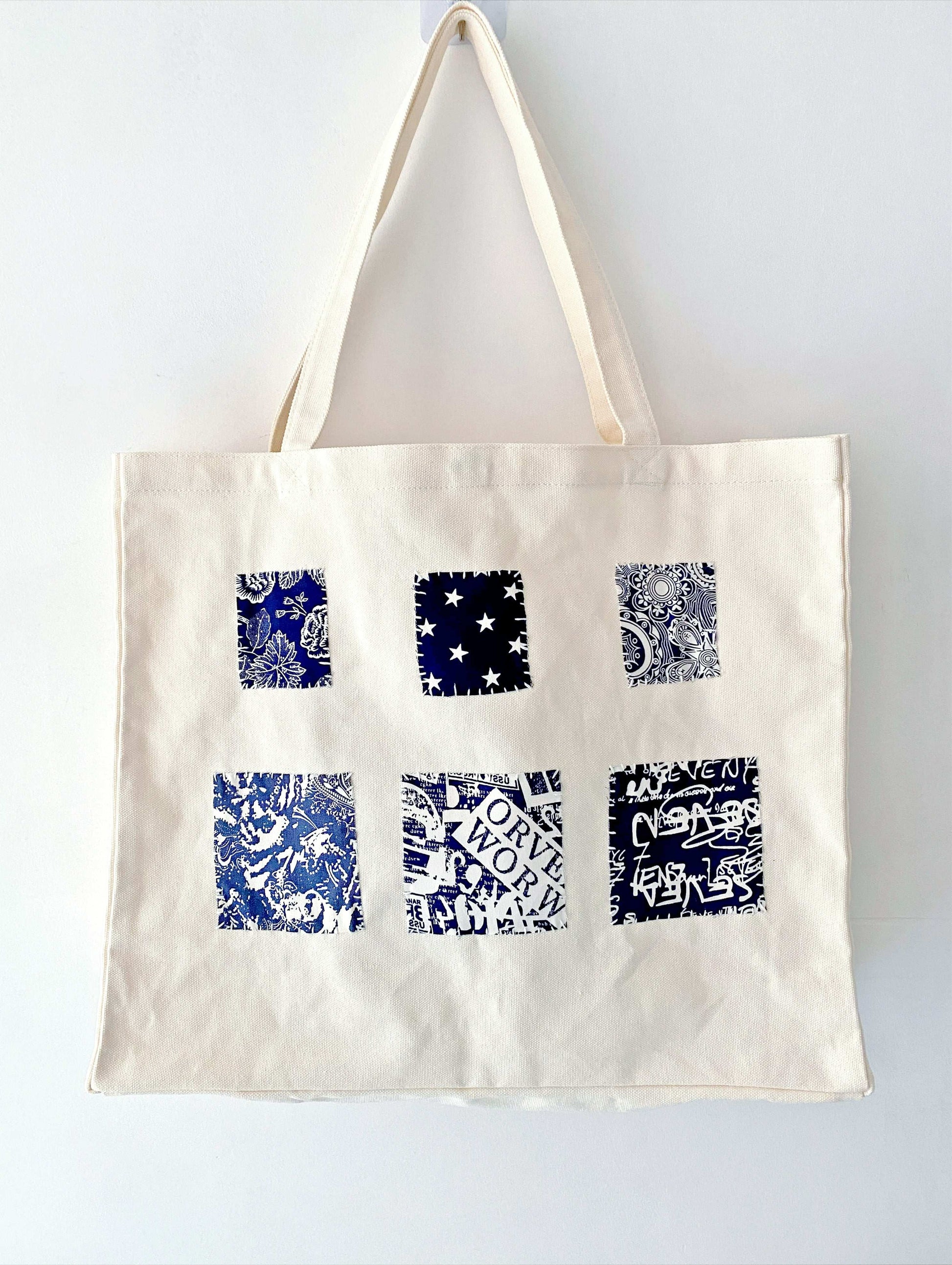 Spacious women's canvas tote bag with durable natural fabric and unique handmade patchwork accents for everyday eco-conscious style.