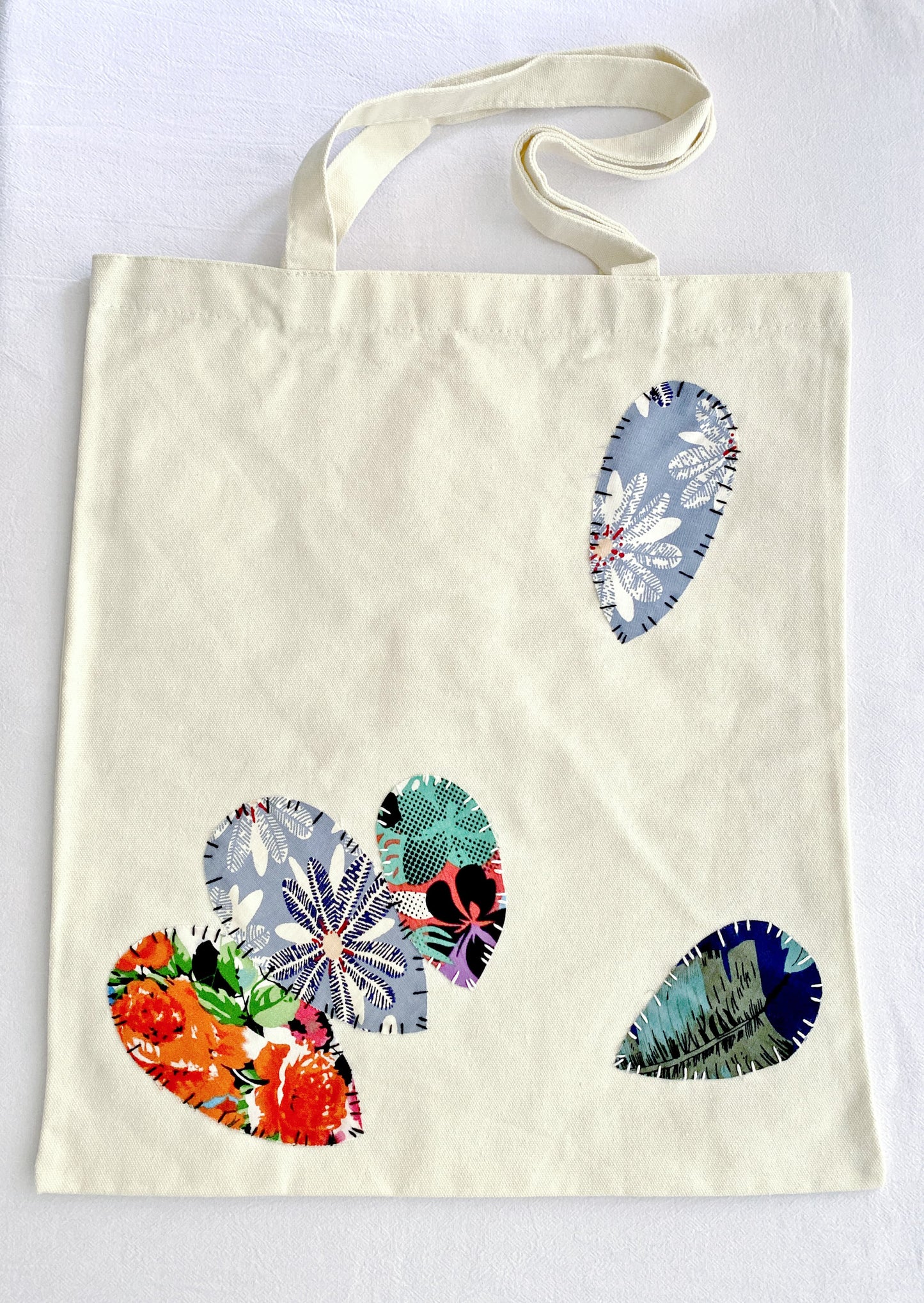 unique canvas shoulder bag with artistic patchwork crafted by hand